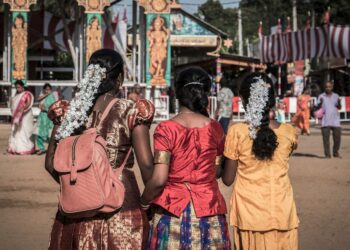 Women in vibrant traditional attire at a festive gathering in Jaffna, Sri Lanka